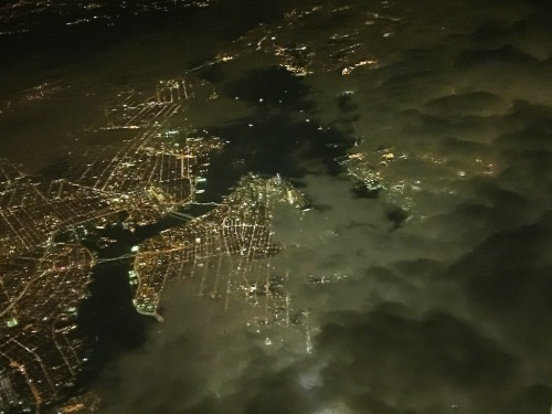 Simply pointed out of my descending plane’s window, the camera on my iPhone 6 Plus was able to capture this cool nighttime moment over Manhattan as we broke through the clouds.
