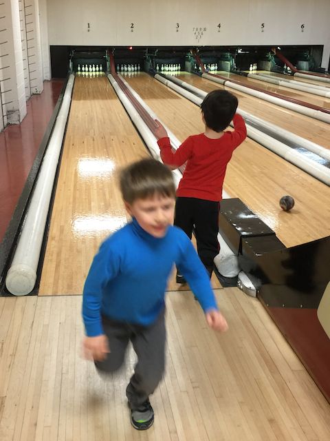 Why is everything crystal clear in this picture except for my son?  The problem is my young bowler is the only part of the image moving quickly!  A faster camera lens could have frozen this action shot.