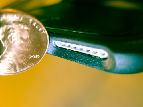 This tiny speaker on my iPhone 6 Plus does a remarkable job projecting sound, but look how small it is! It can only go so far. Is there a way to give it more oomph? My solution came from a surprising source…