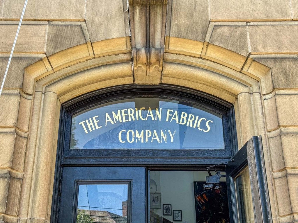 The American Fabrics Company sign at entrance